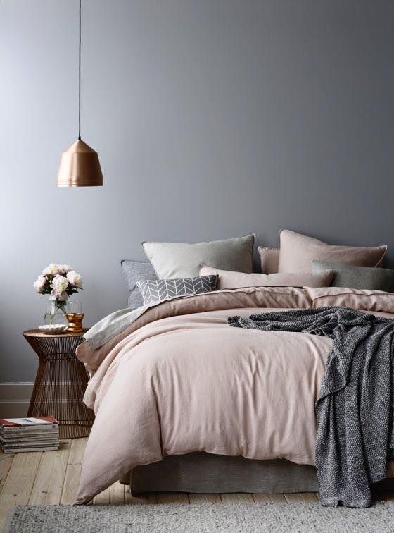 A Bedroom With A Bed, A Nightstand, And A Lamp — Aaron Lee Painting Pty Ltd In Douglas, QLD