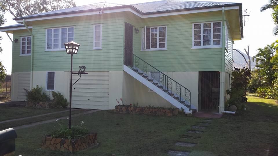 A Green And White House With Stairs Leading Up To It — Aaron Lee Painting Pty Ltd In Jensen, QLD