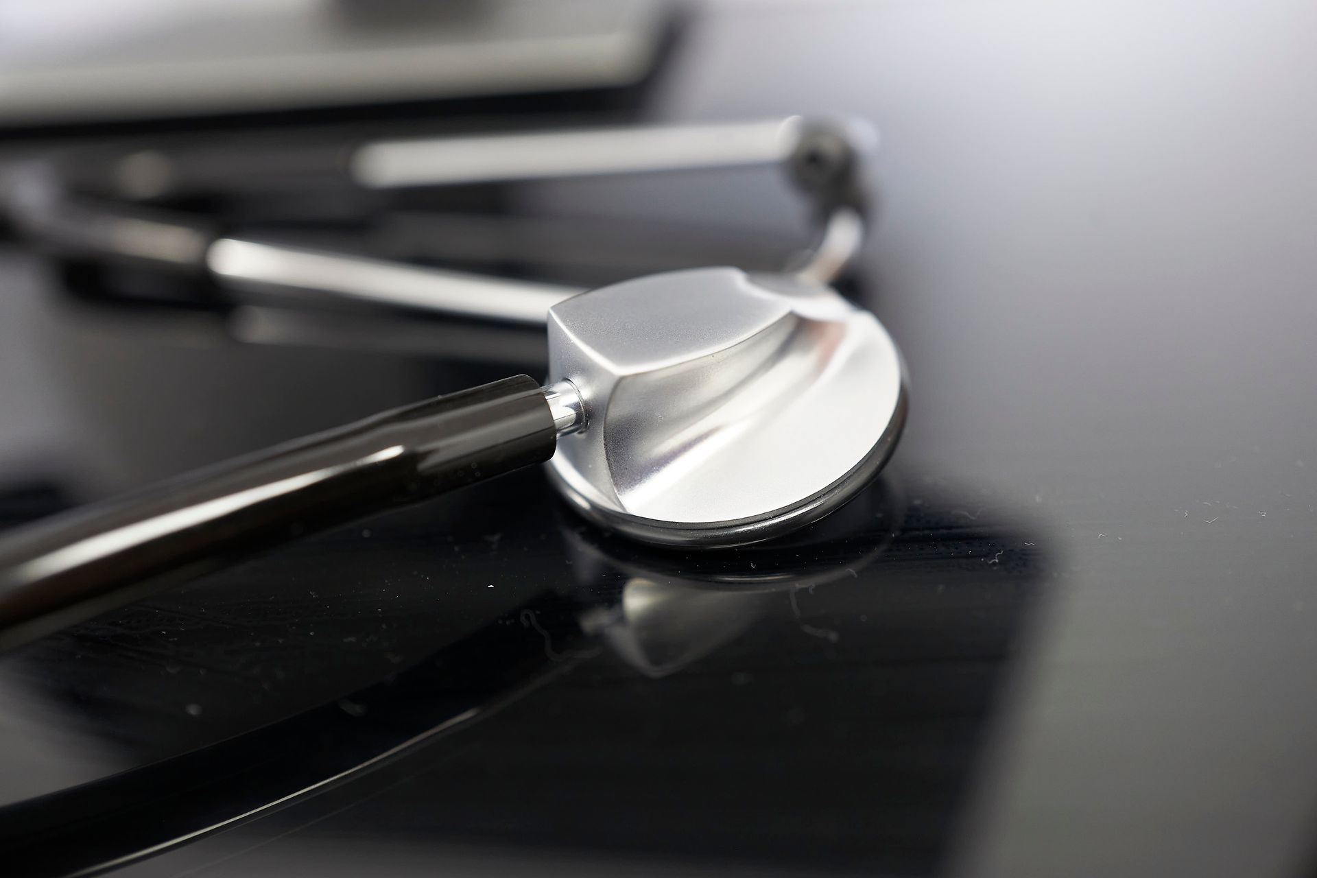A close up of a stethoscope on a table.