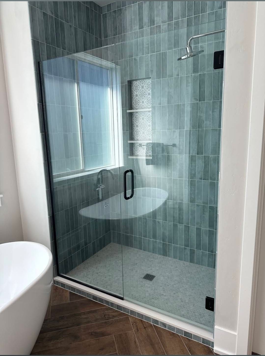 Modern custom shower glass enclosure in Central Oregon home