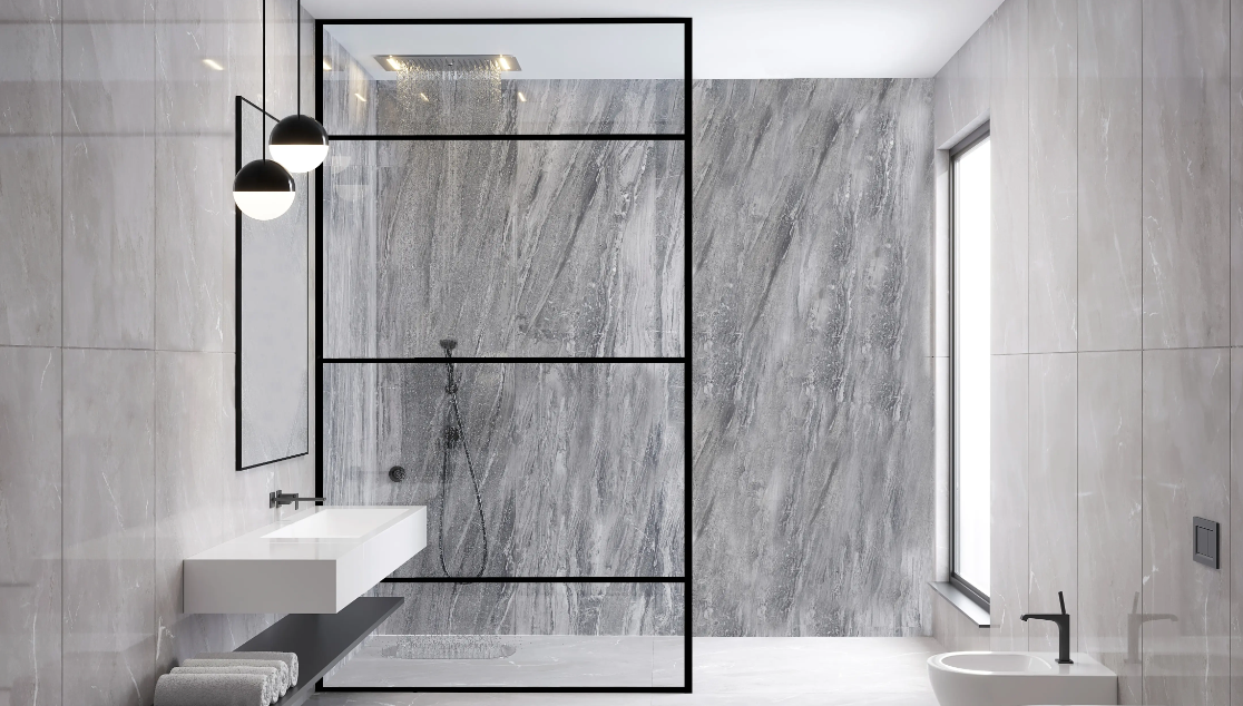 Modern gray marble bathroom featuring a walk-in shower with black-framed glass, a wall-mounted sink, and a bidet.