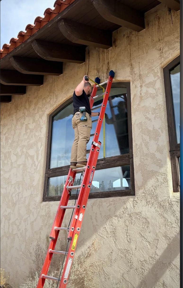 Glass Daddy crew replacing exterior windows on a stucco home in Central Oregon