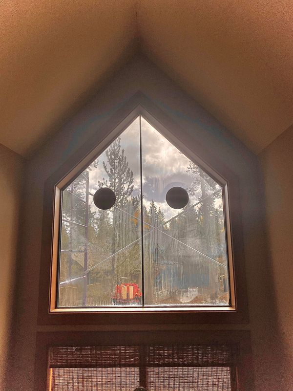 Pentagonal window with suction cup tools for glass repair - Glass Daddy Redmond OR