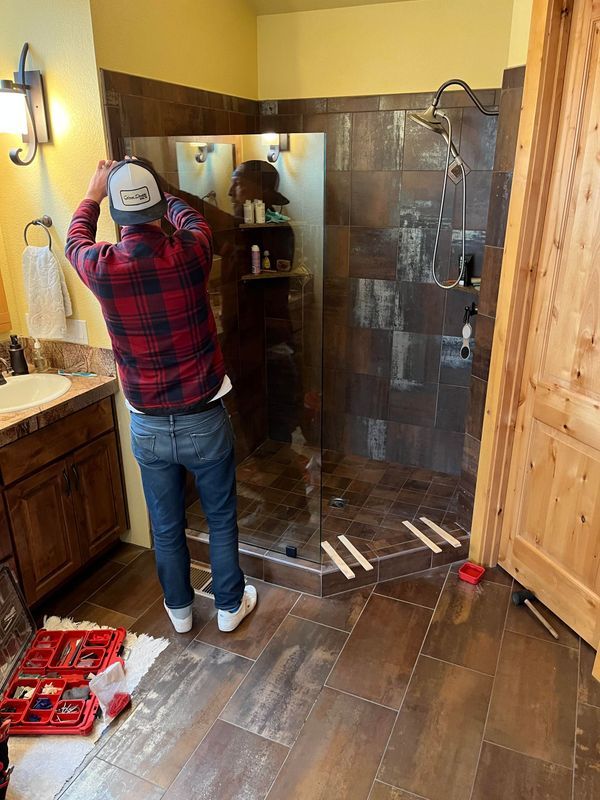 Glass Daddy technician installing a frameless shower glass door in Redmond OR