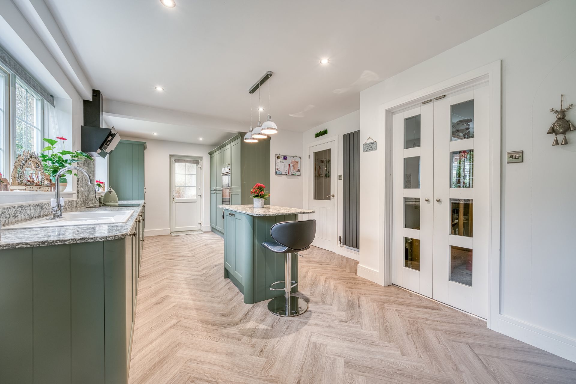 kitchen with olive cabinets and modern layout