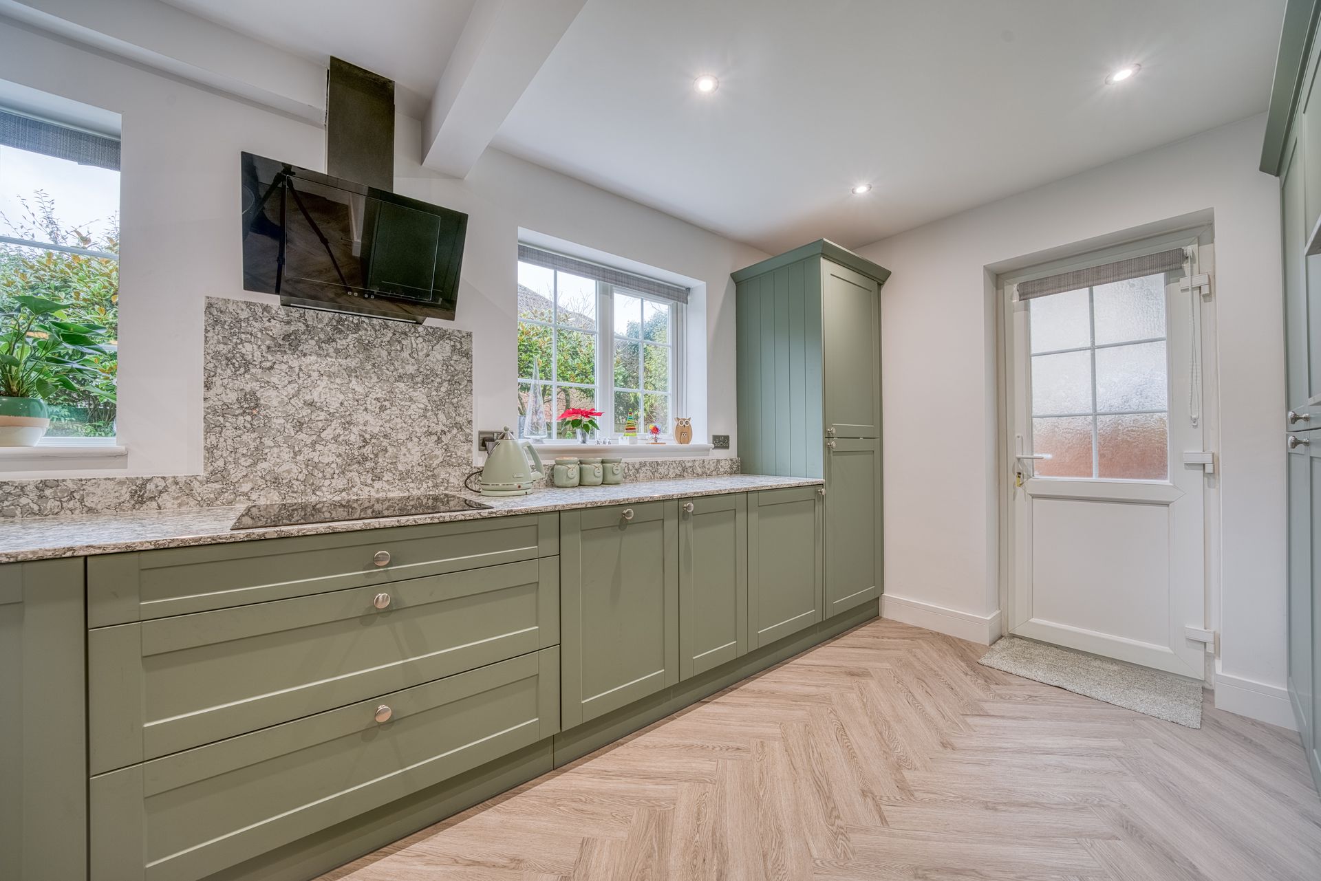kitchen with olive cabinets and modern layout