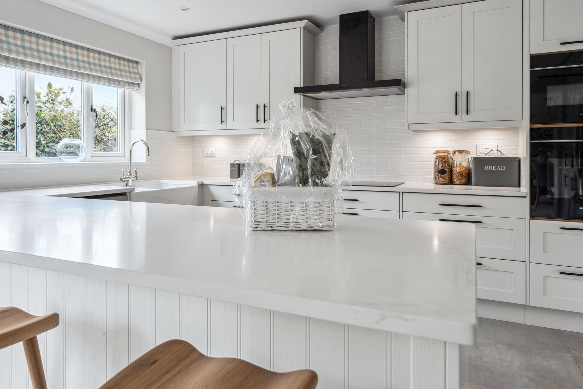 Modern kitchen with white cabinets and white worktop
