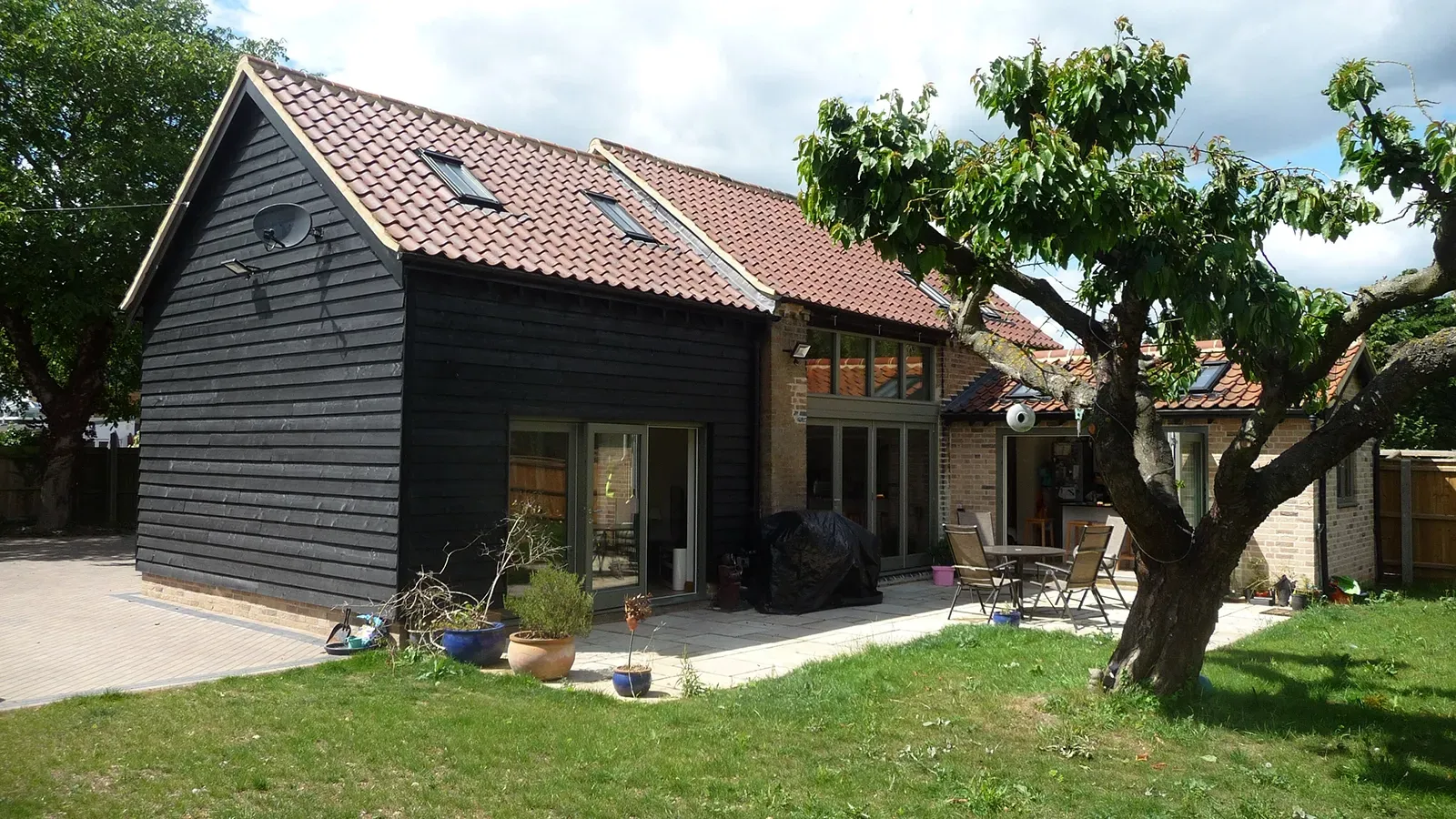 A large house with a tree in front of it