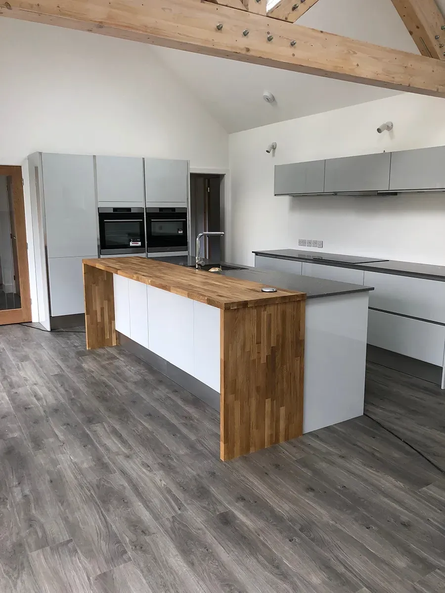 A kitchen with a large island in the middle of the room.