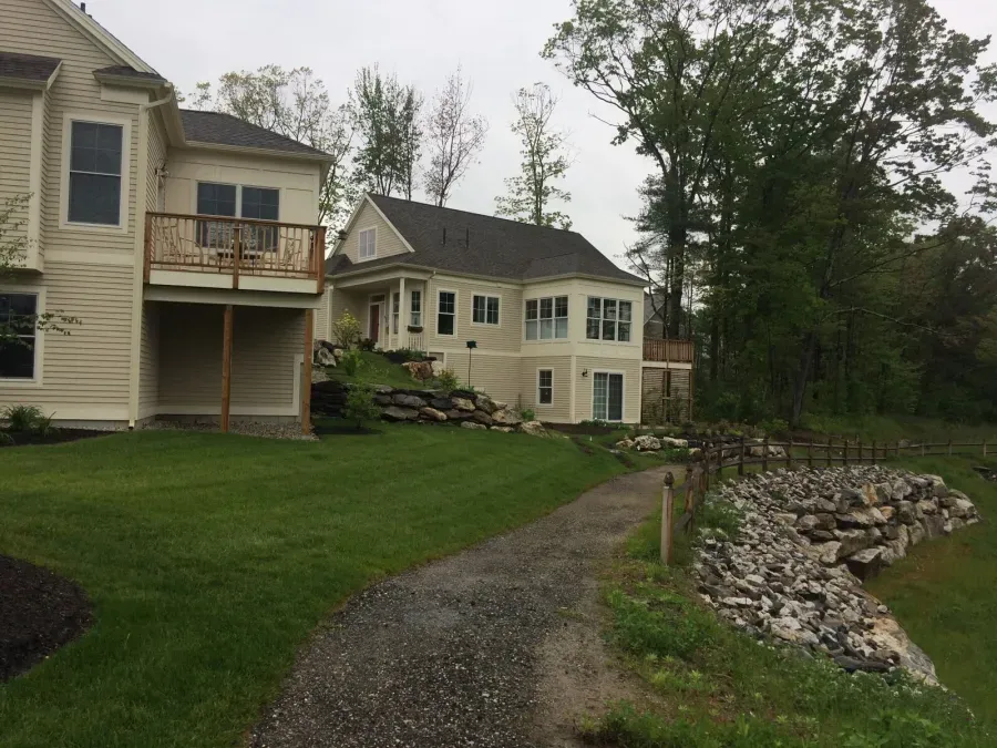 A large house with a driveway leading to it