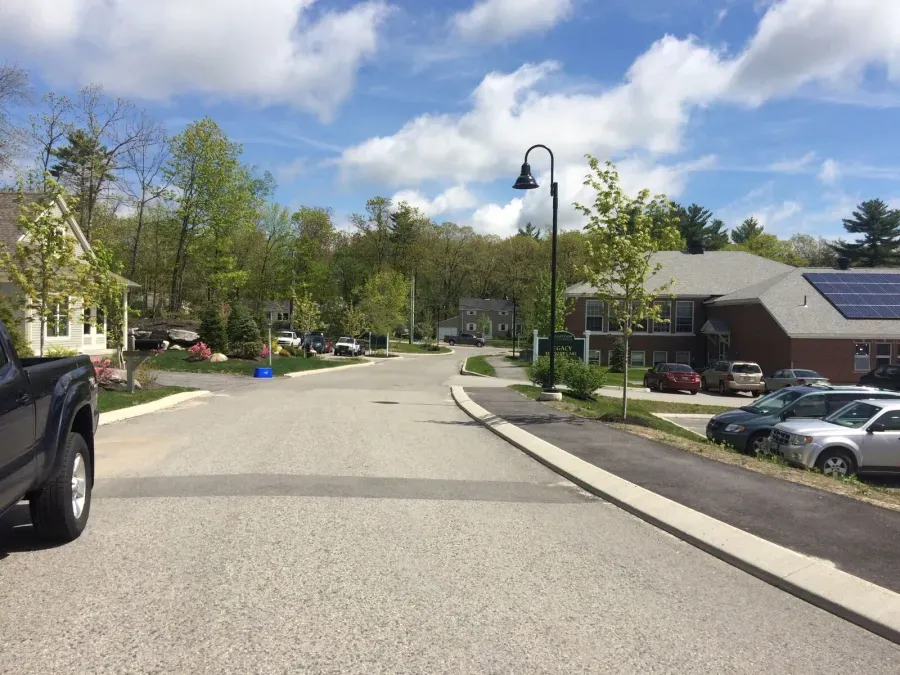 A truck is parked on the side of the road in a residential area.