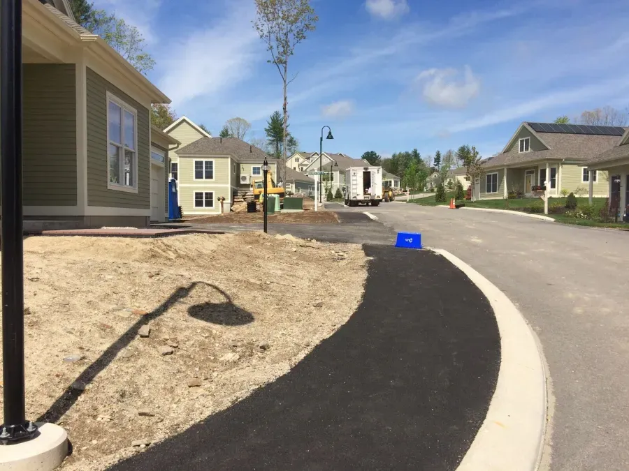A row of houses are being built in a residential area