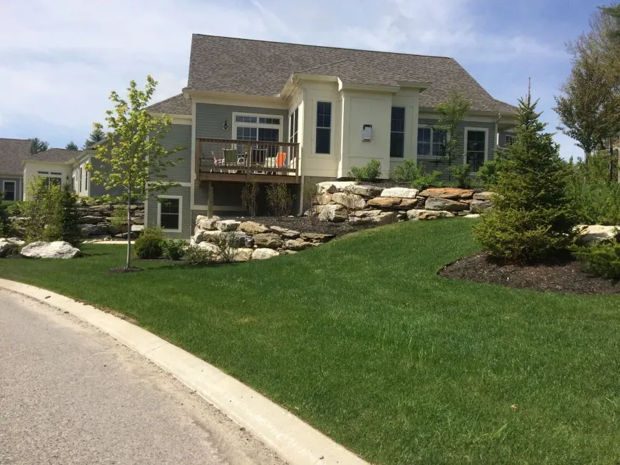 A large house with a large lawn in front of it