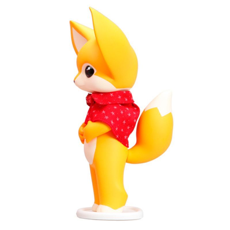 Yellow Fennec Dona fox with large ears, wearing a red cape, standing on a white base.