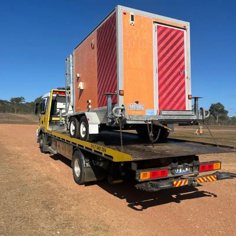 A Tow Truck With a Trailer on the Back of It — Mareeba Express Towing in Mareeba, QLD