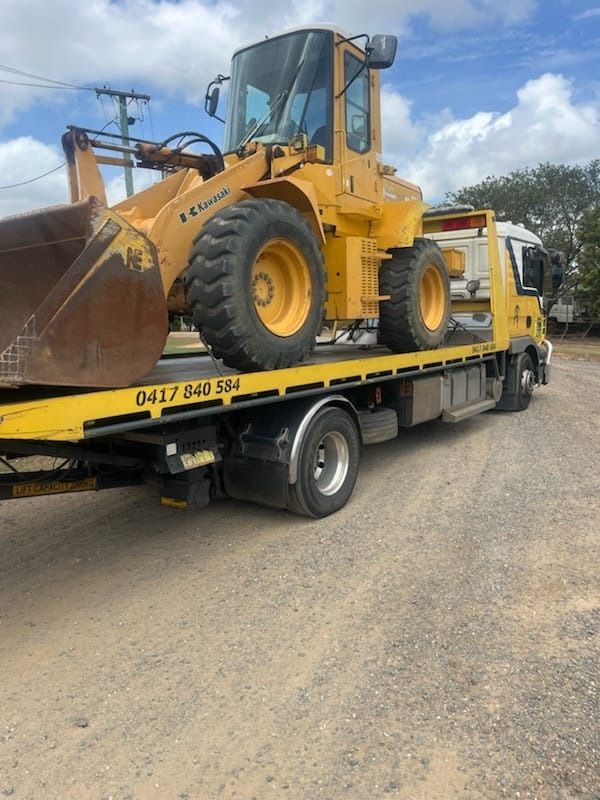 A Red Truck is Sitting on Top of a Tow Truck — Mareeba Express Towing in Mareeba, QLD