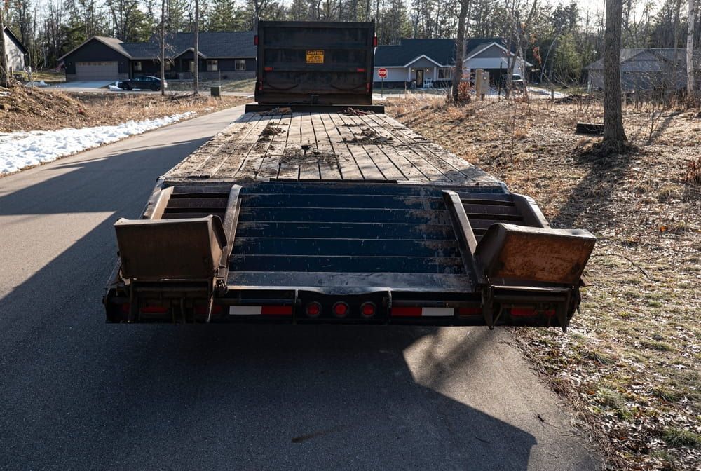 A Trailer is Parked on the Side of a Road — Mareeba Express Towing in Innisfail, QLD