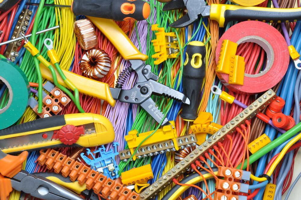 Bunch of Electrical Tools and Wires on a Table — Proserpine Electrical Services in Whitsundays, QLD