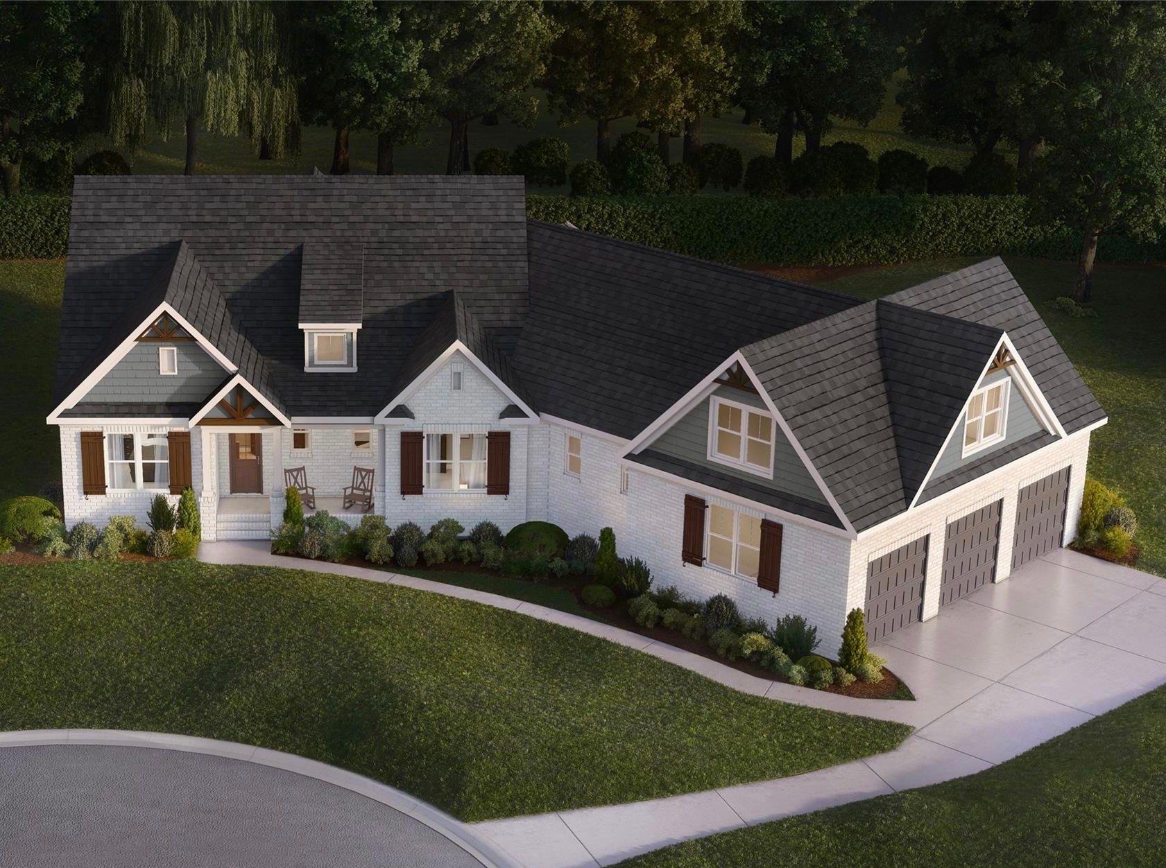 An aerial view of a white house with a black roof