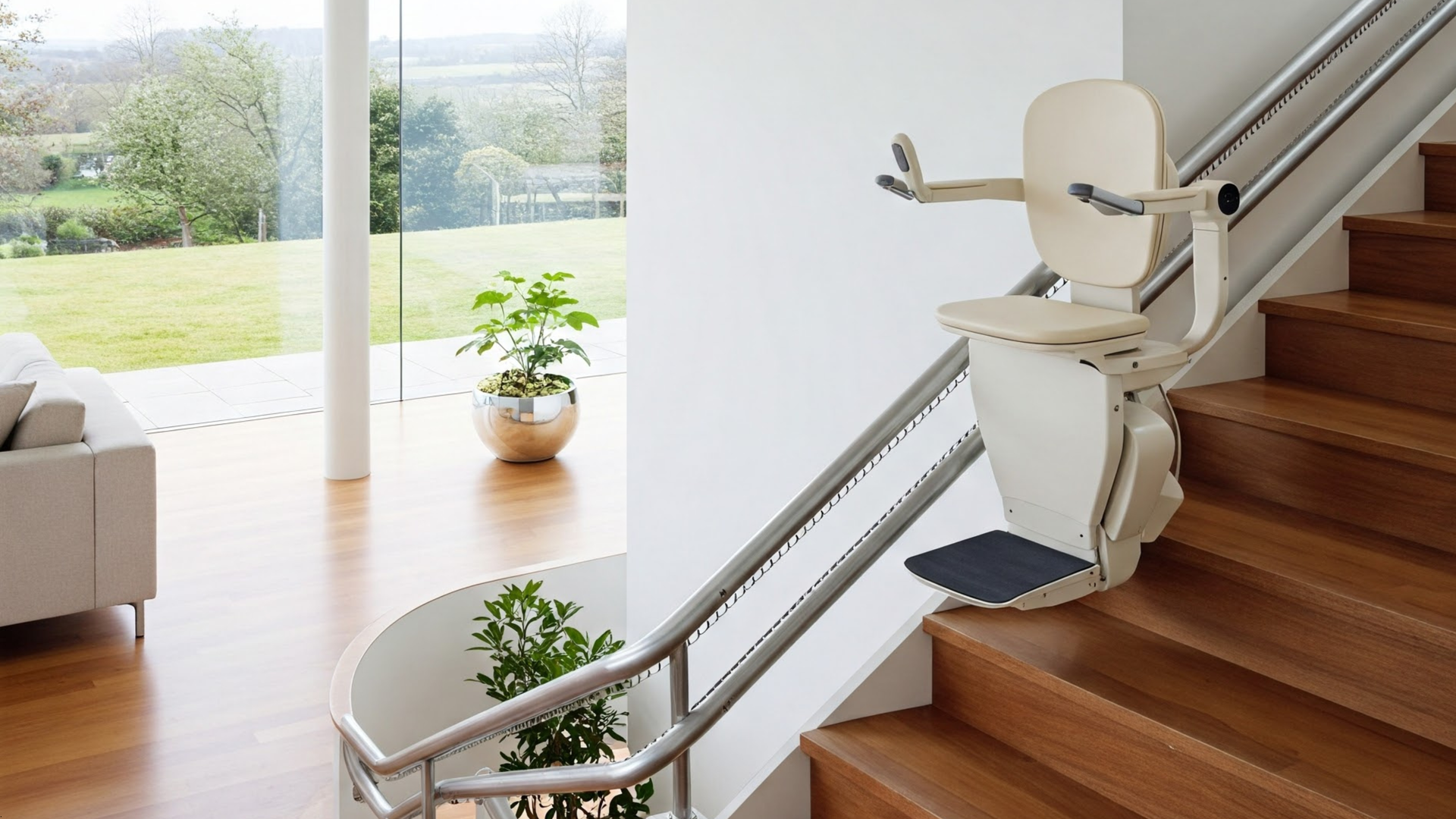 Stair lift installed on a wooden staircase with a beige seat and silver railing. Interior shot, sunny day.