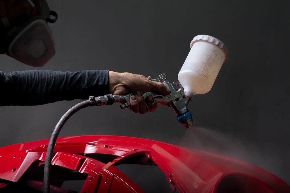 A Person Is Polishing A Car With A Machine — PK Crash Repairs In Tennant Creek, NT