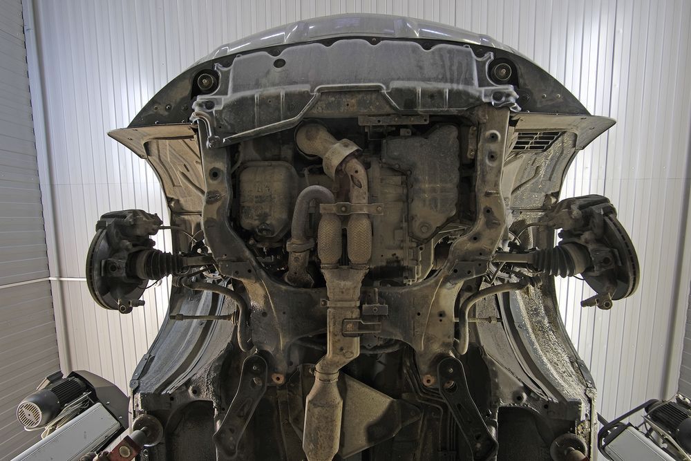 The Underside Of A Car Is Shown In A Garage — PK Crash Repairs In Ciccone, NT