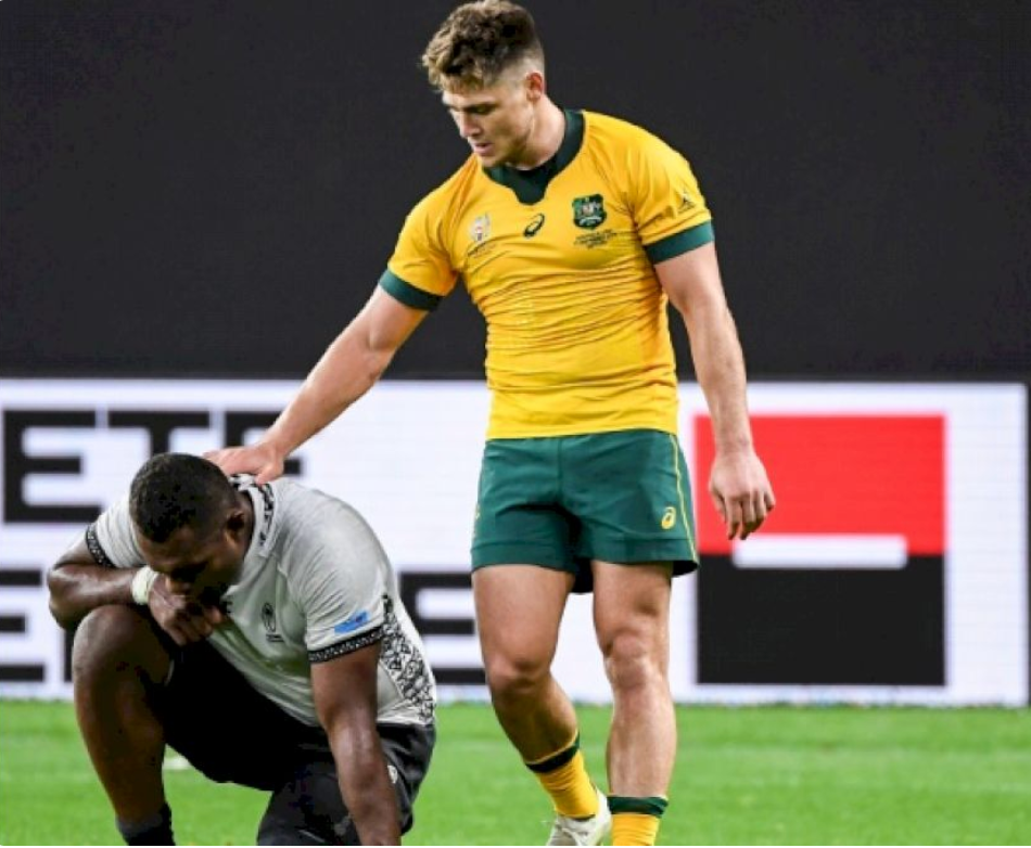 Rugby player consoles fellow player