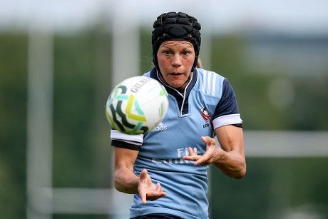 Woman passes rugby ball