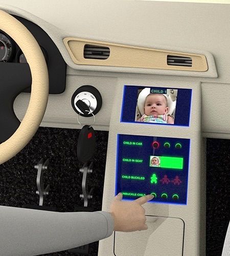 A person is pointing at a screen with a baby on it
