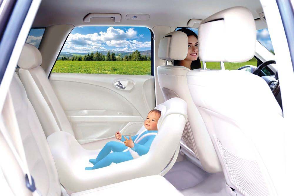 A group of people are sitting in the back seat of a car.