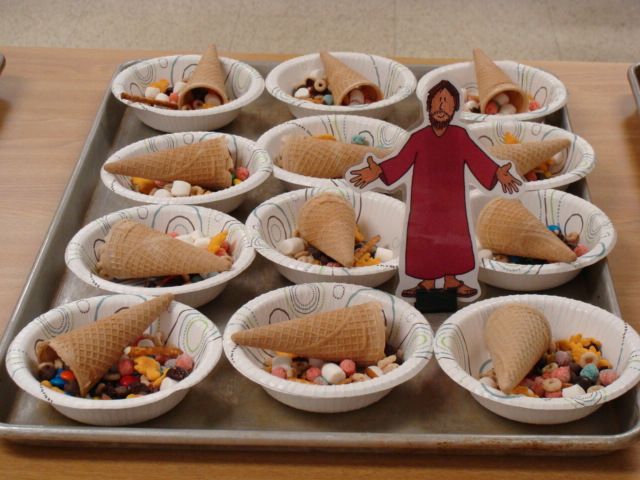 Dessert tray with small cone-shaped treats and a cutout figure standing among them
