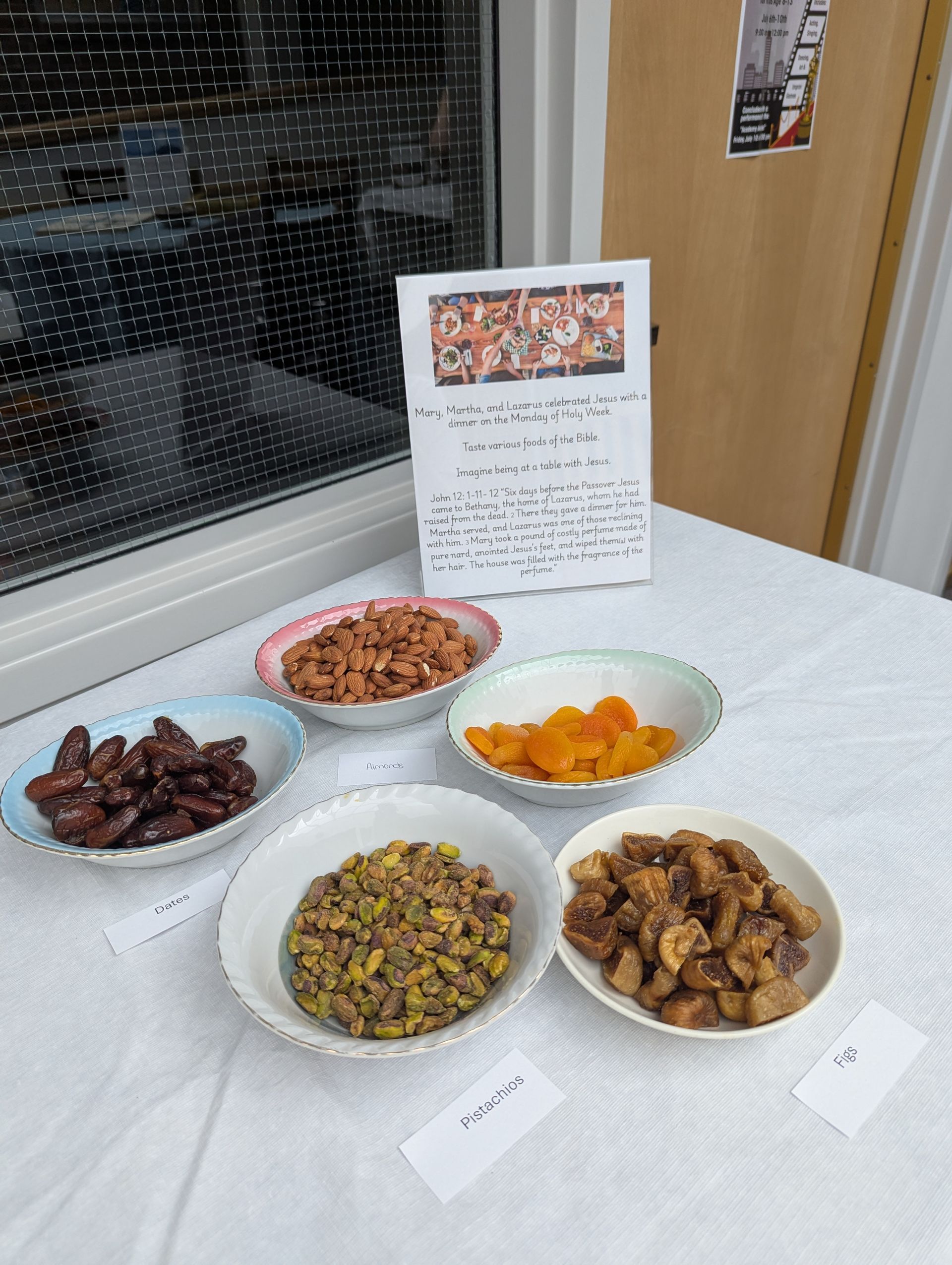 Five bowls of assorted snacks displayed on a table with a recipe card behind them.