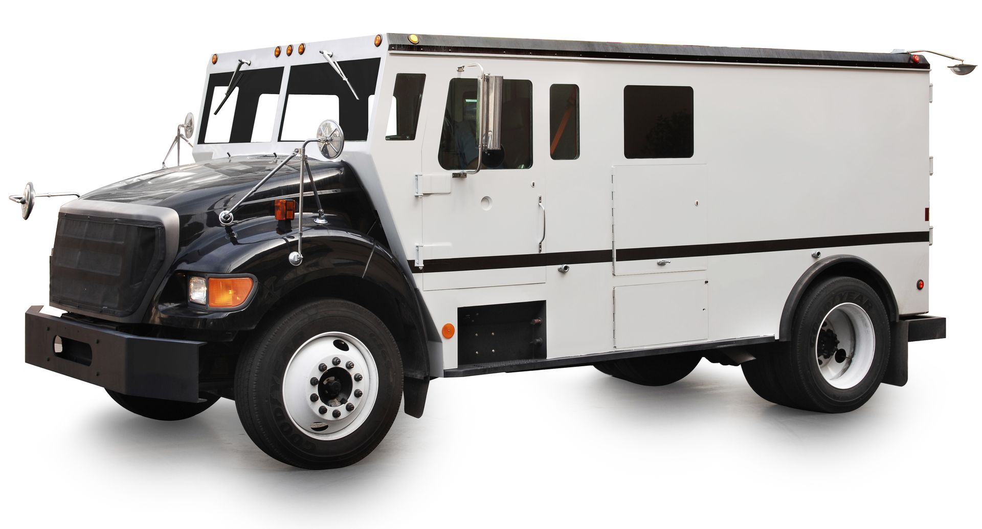 Armored truck, black cab, white cargo area, parked on white surface.