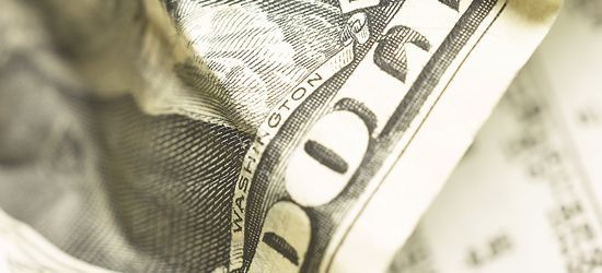 Close-up of a ten dollar bill with the word
