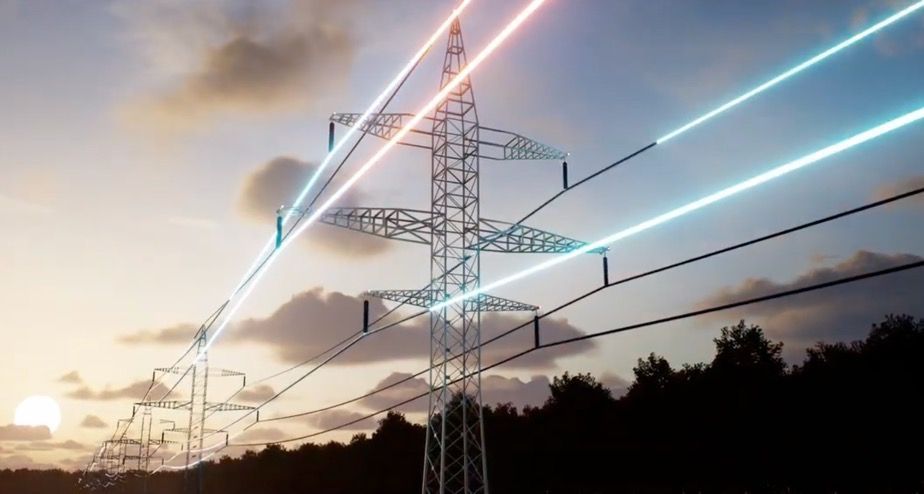 Power lines illuminated in pink and blue, connected to a metal electricity pylon against a sunset sky.