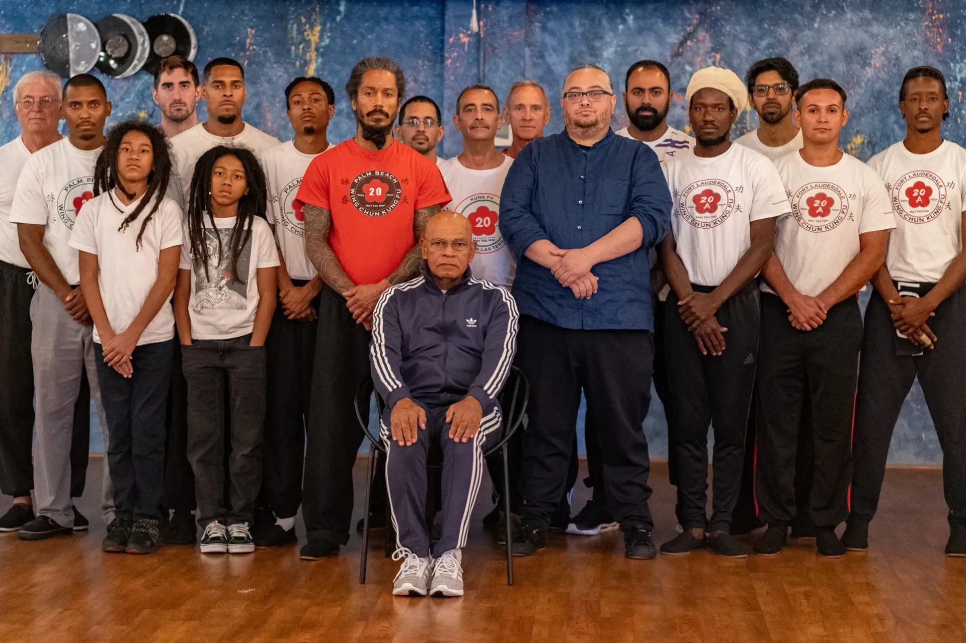 A group of people are posing for a picture in a room.