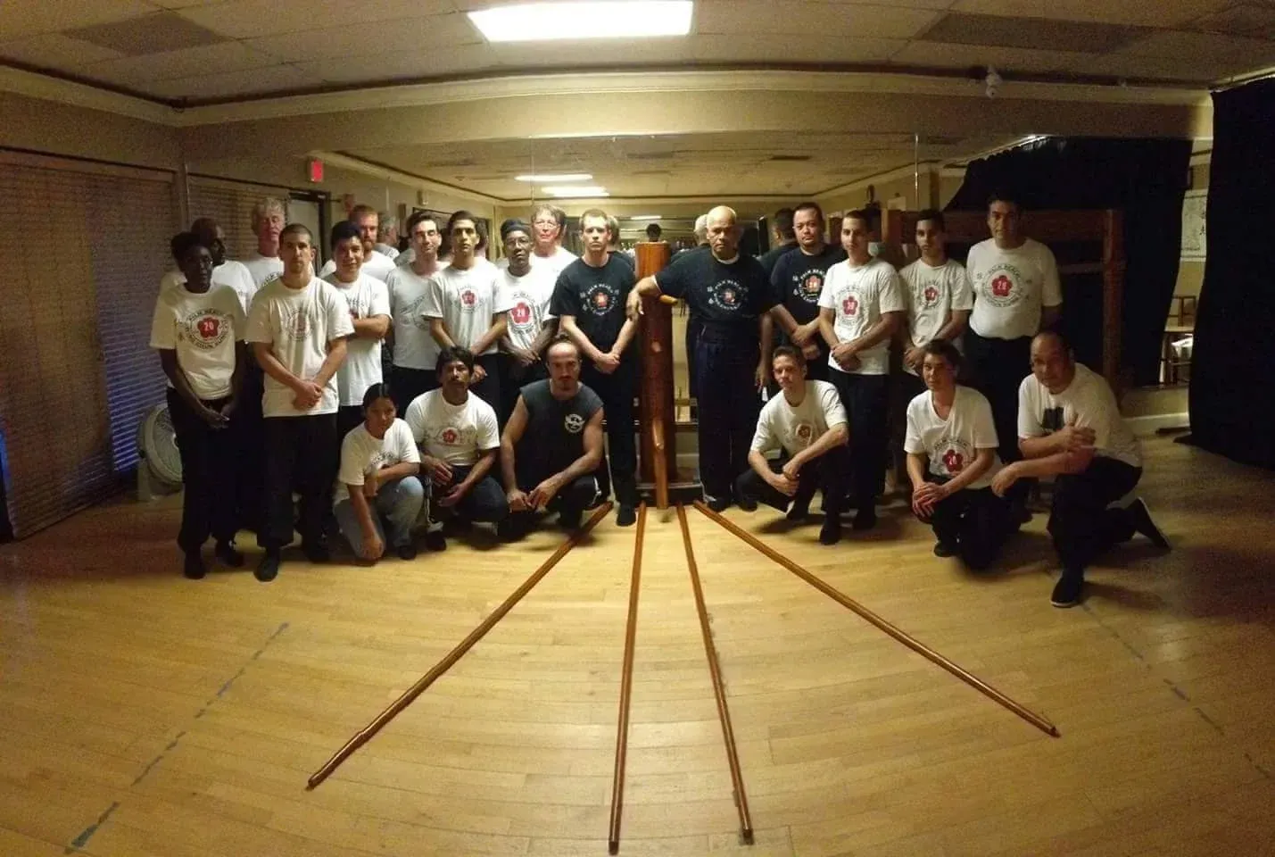 A group of people are posing for a picture in a room