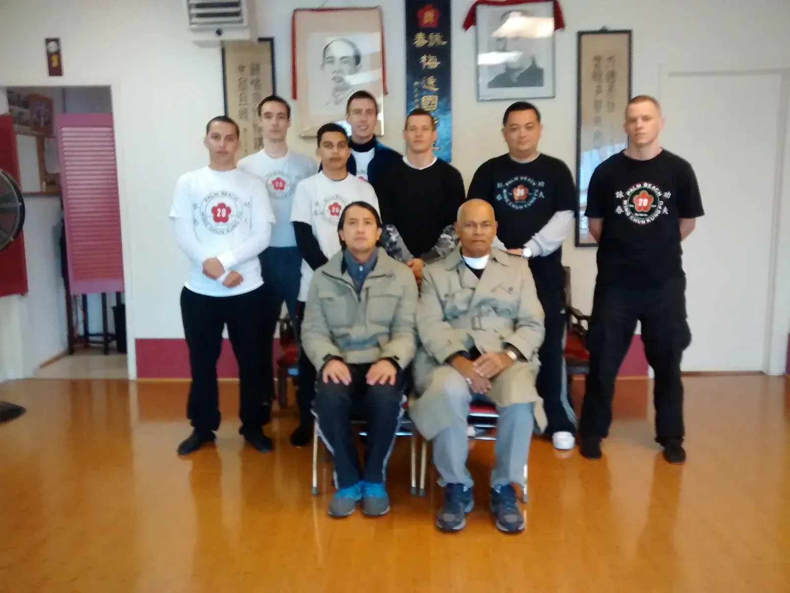 A group of men are posing for a picture in a room