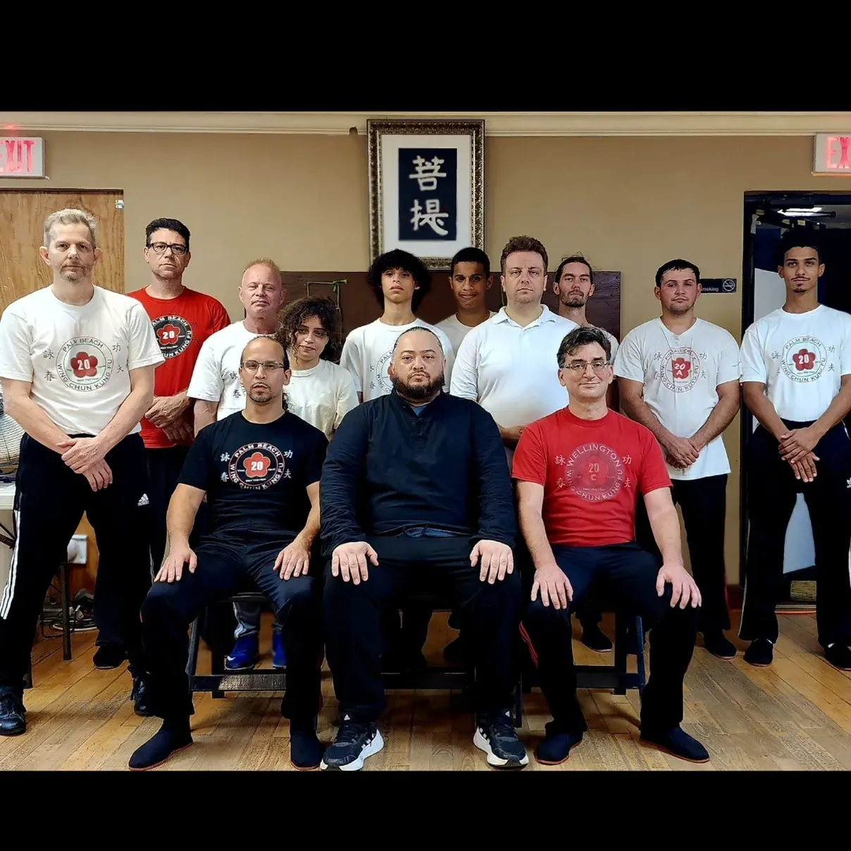 A group of people are posing for a picture in a room.