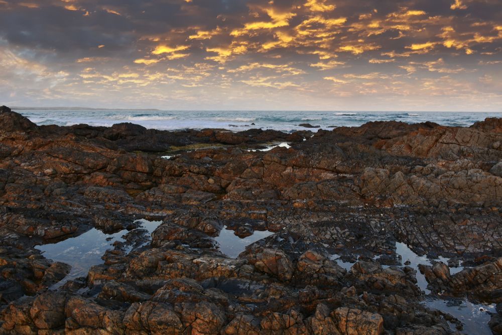 Rocky Coastline at Sunset, with Orange and Gold Clouds — Audiomation In Diamond Beach, NSW