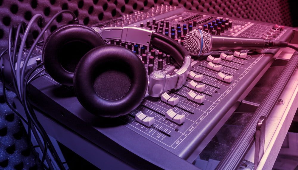 A Pair of Headphones and a Microphone Are Sitting on Top of a Mixer — Audiomation in Pacific Palms, NSW