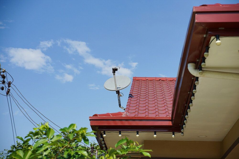 A Satellite Dish is on the Roof of a House — Audiomation in Mid North Coast, NSW
