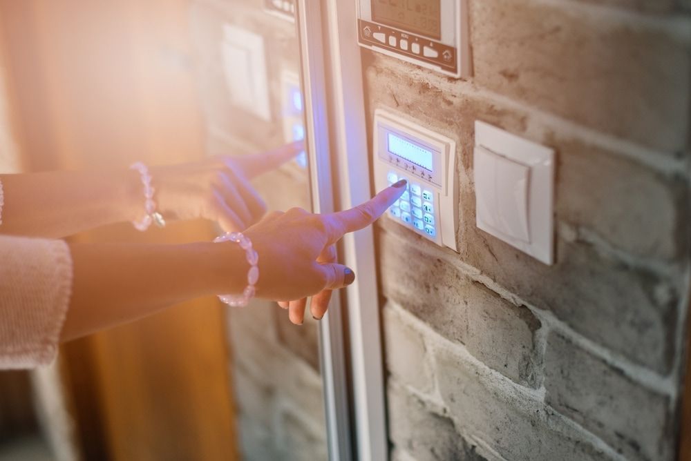 A Person is Pressing a Button on a Security System — Audiomation in Nabiac, NSW