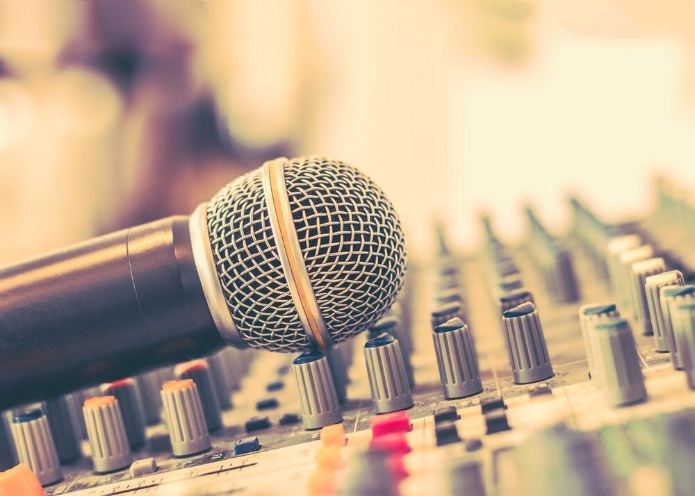 A Microphone is Sitting on Top of a Sound Mixer — Audiomation in Taree, NSW