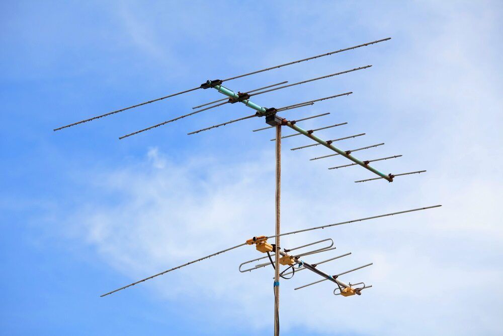 A Large Antenna is Against a Blue Sky With Clouds — Audiomation in Tuncurry, NSW