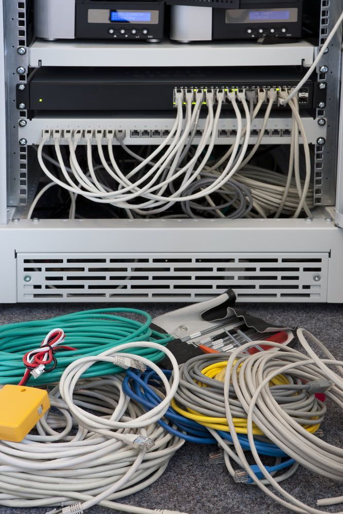 A Bunch of Wires Are Laying on the Floor in Front of a Server — Audiomation in Nabiac, NSW