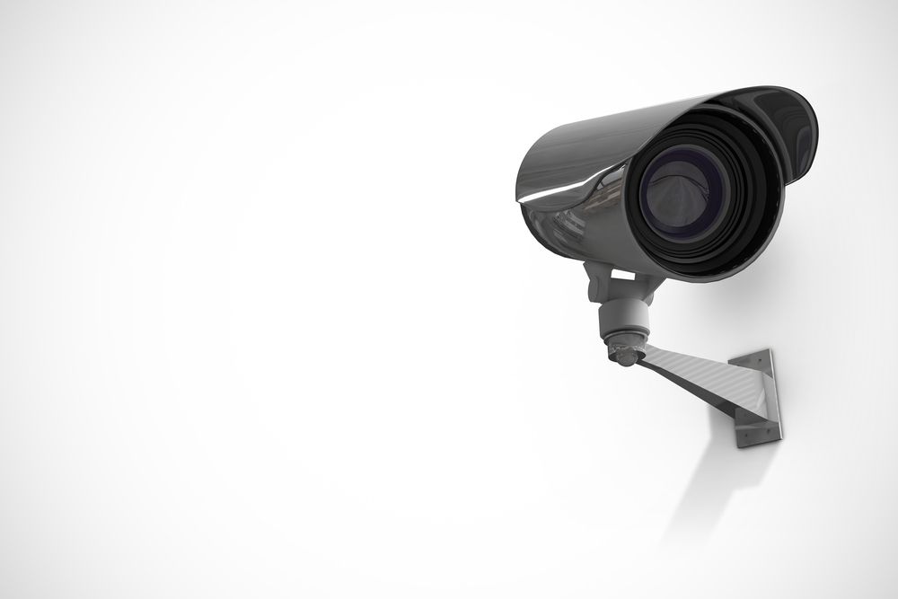 A Security Camera is Mounted on a White Wall — Audiomation in Taree, NSW