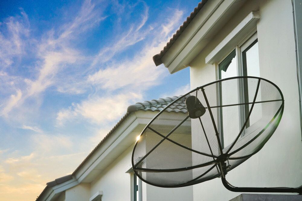 A Satellite Dish is Mounted on the Side of a House — Audiomation in Mid North Coast, NSW