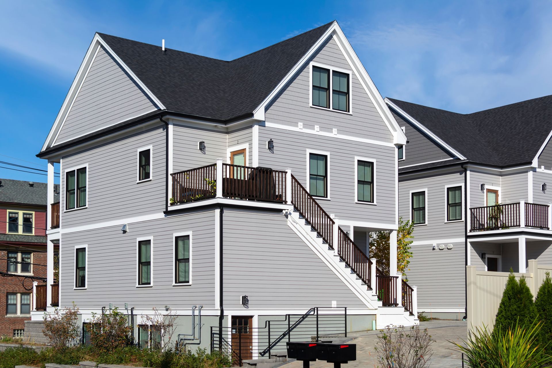A large house with stairs leading up to the second floor
