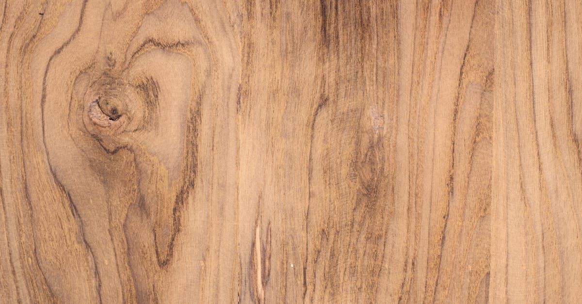A close up of a piece of wood with a knot in it.